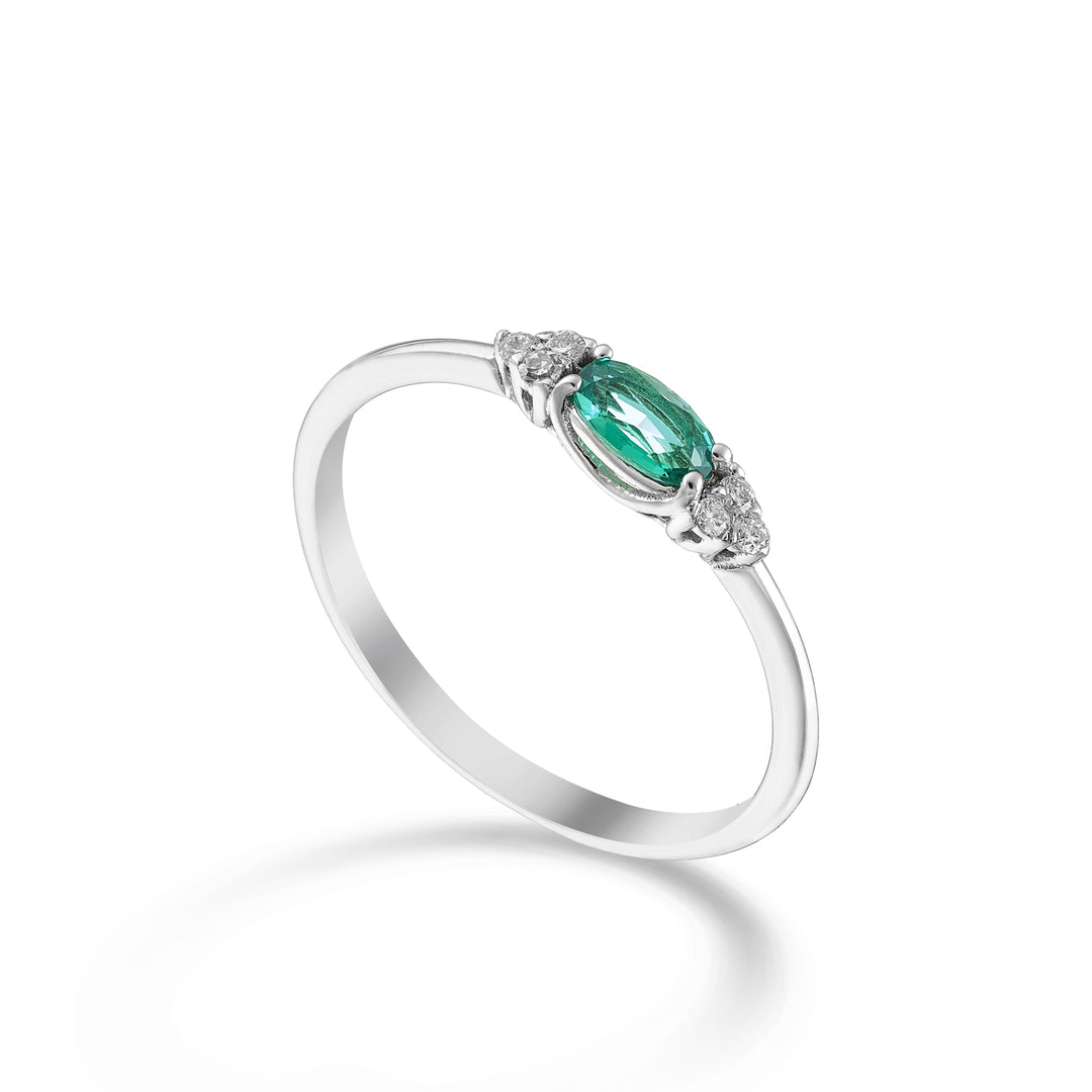 Nihama an 18k oval emerald 5x3 arranged lengthways and side diamonds NA5212O4BE