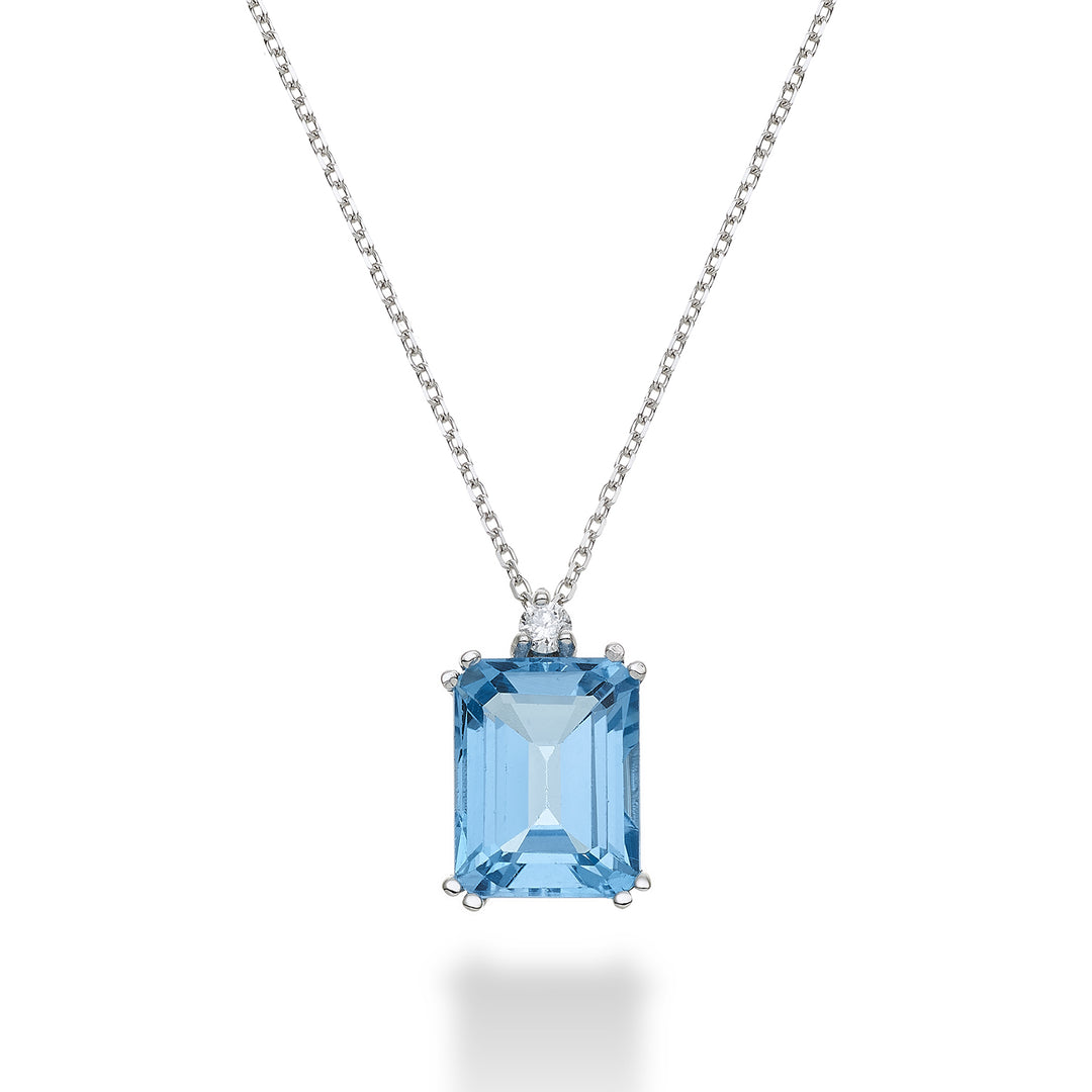 Nihama cl 18k achteckiger blauer Topas 7x9 ct.2,90 Durchm. ct.0,04 NPCL090DITPAZ4O4