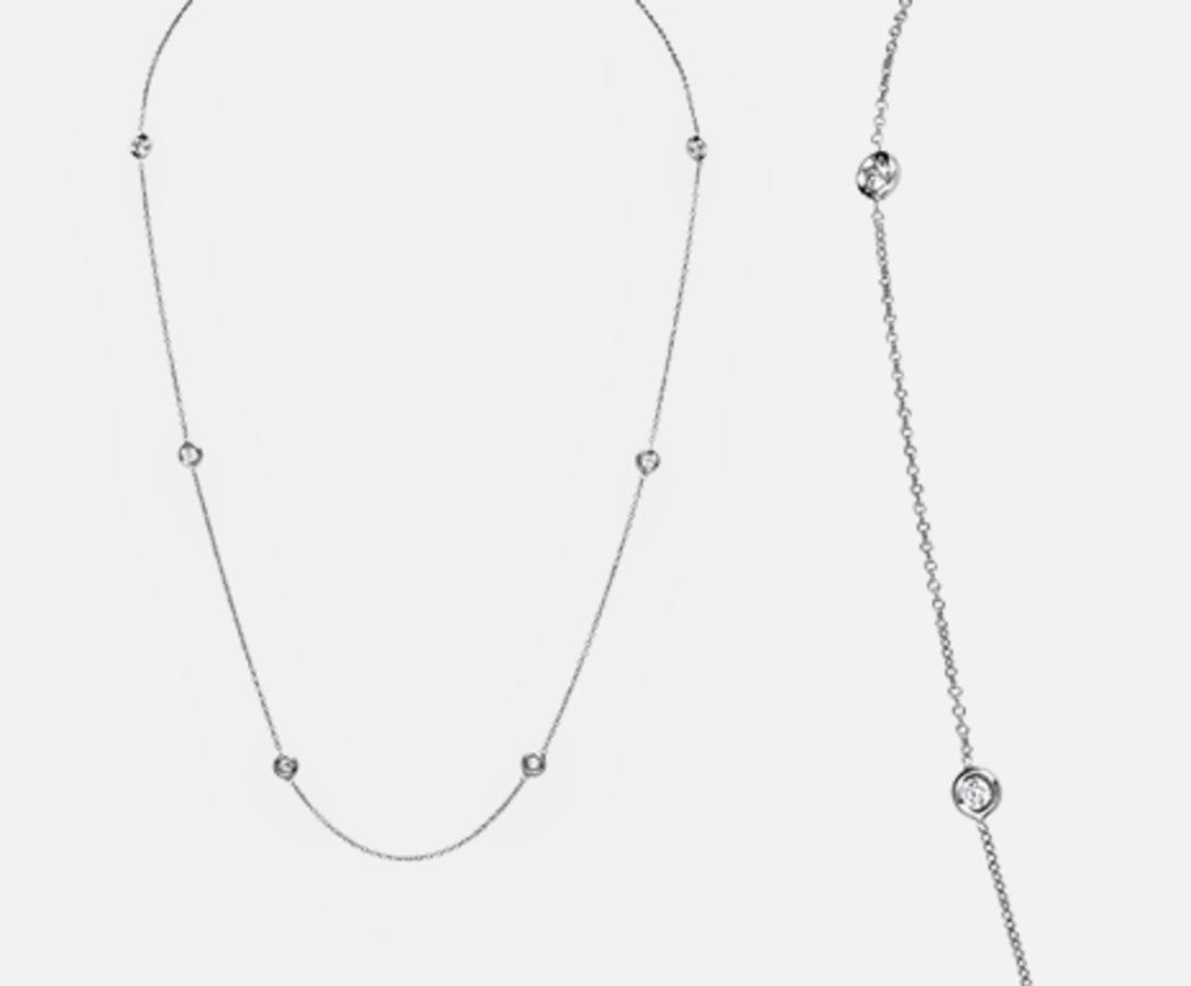 Mikiko cl 18k ct.0,33 cm.44 totalt MD5032O4BR033